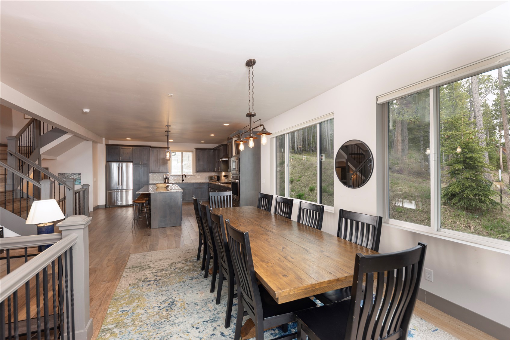 260 Fuller Placer Road Breckenridge, CO 80424 - Photo 11 of 32 a dining room with furniture a chandelier and wooden floor