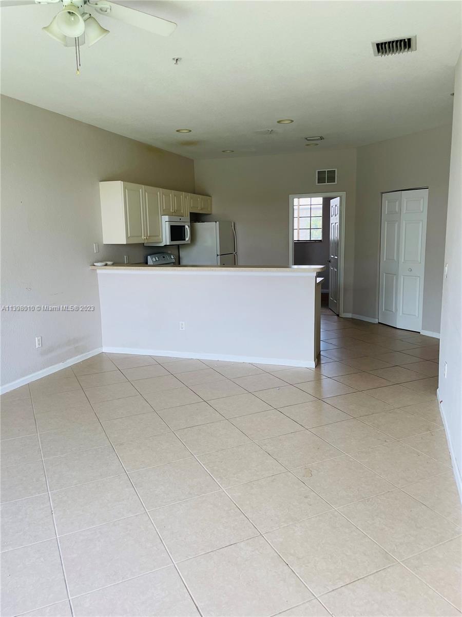 Riviera Beach Riviera Beach, FL 33404 - Photo 6 of 10 a view of kitchen and front door