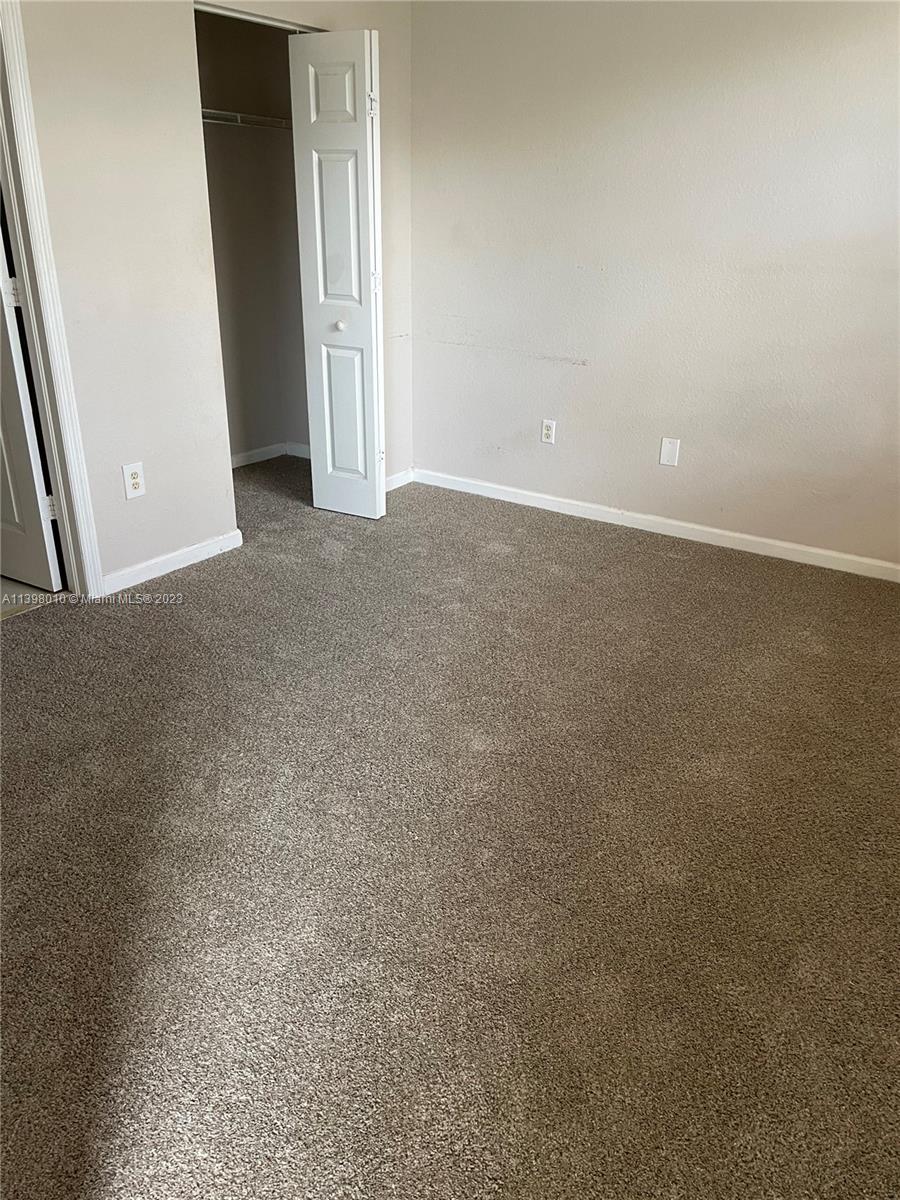 Riviera Beach Riviera Beach, FL 33404 - Photo 9 of 10 an empty room with windows