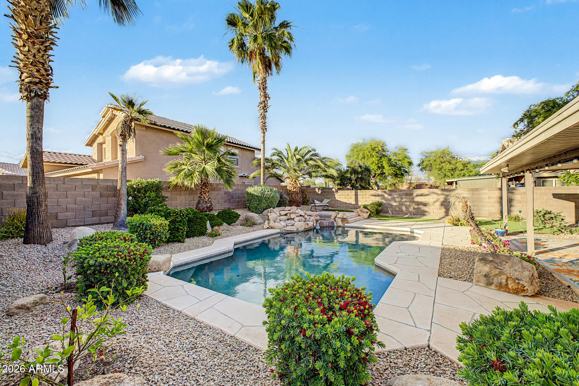 4102 East Rock Wren Road Phoenix, AZ 85044 - Photo 23 of 25 a view of a swimming pool with a patio