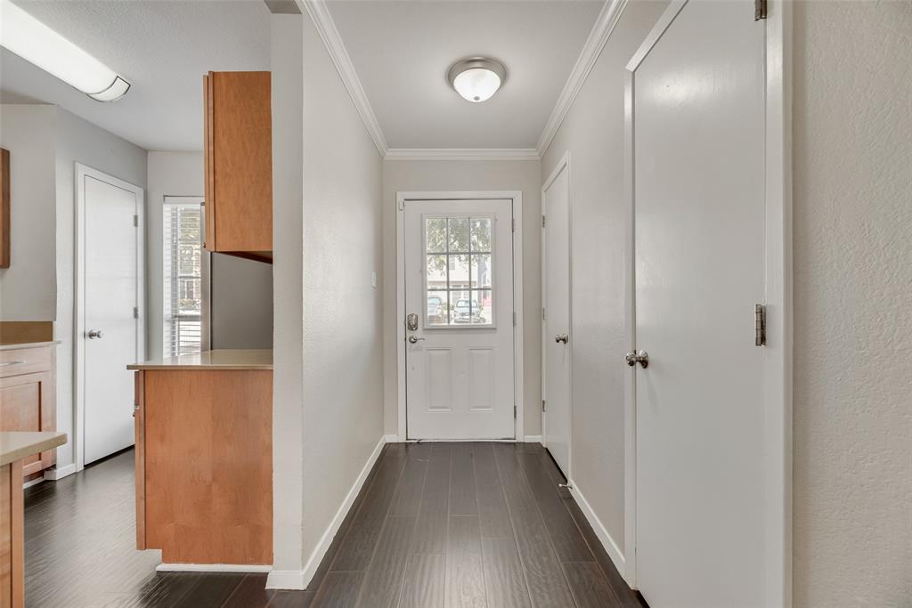 43 Abbey Road Euless, TX 76039 - Photo 5 of 22 a view of a hallway with wooden floor