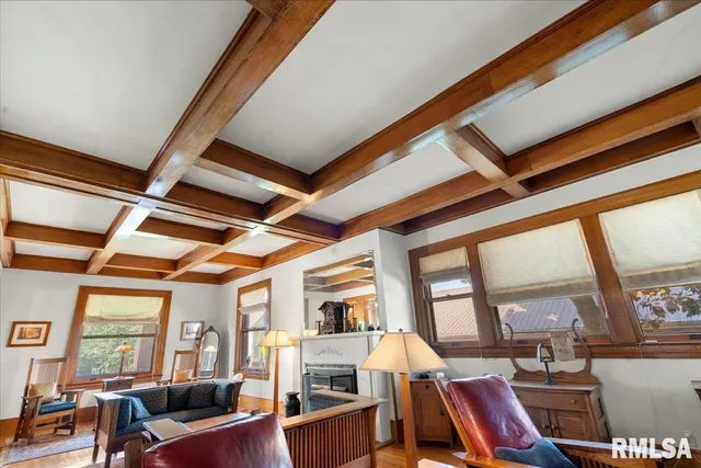 a living room with lots of furniture and a fireplace