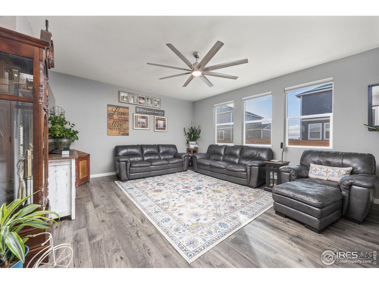 3725 Catmint Street Wellington, CO 80549 - Photo 12 of 44 This great room offers space and plenty of light. The open design and large windows create a bright and welcoming atmosphere, perfect for both relaxation and entertaining.