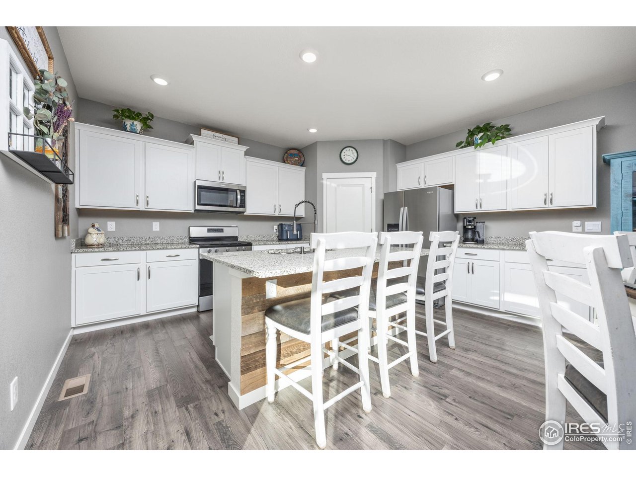 3725 Catmint Street Wellington, CO 80549 - Photo 17 of 44 The kitchen features ample cabinet storage, a gas cook stove, refrigerator, and a deep sink conveniently located on the island.