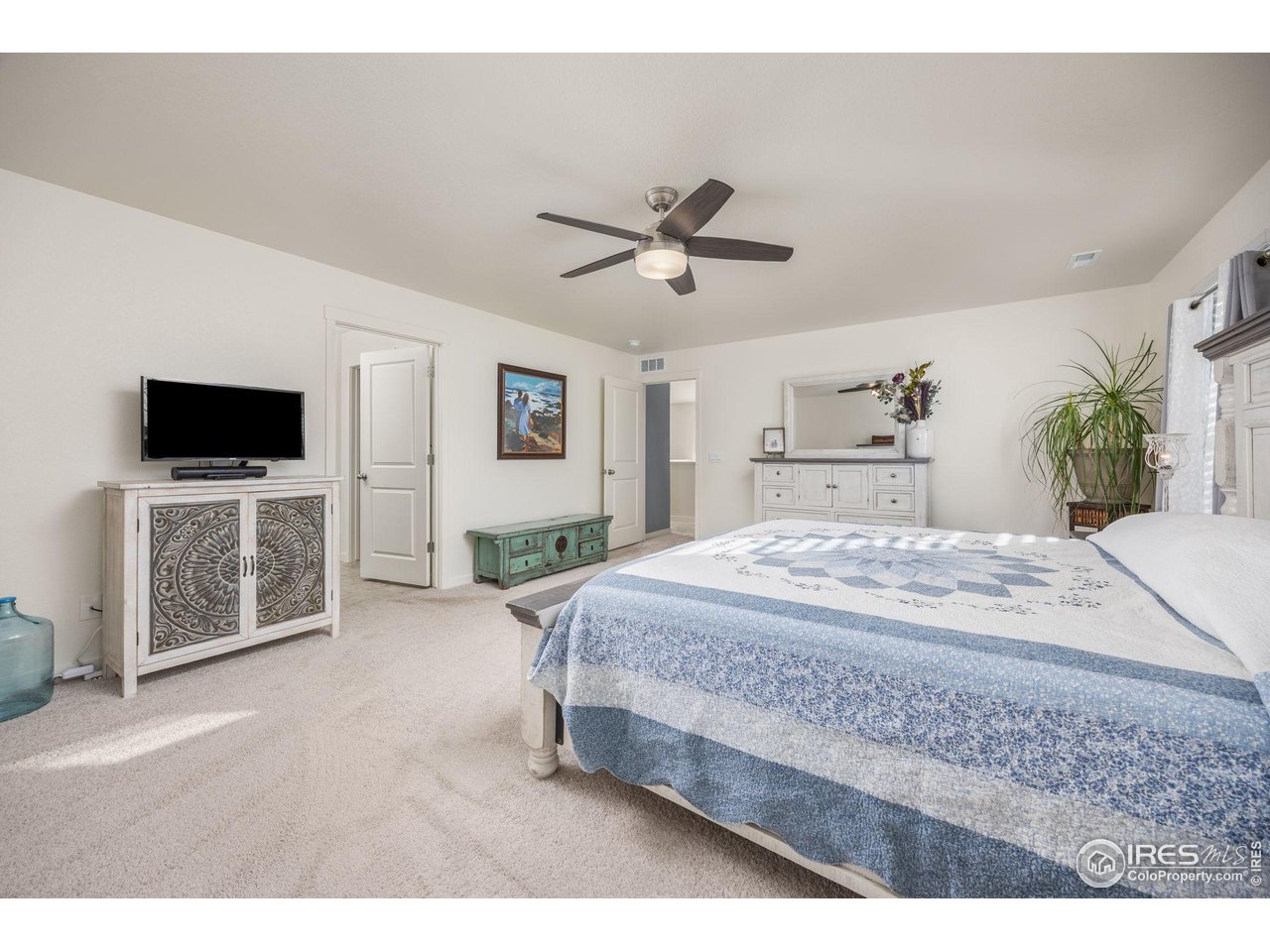 3725 Catmint Street Wellington, CO 80549 - Photo 23 of 44 Primary bedroom featuring ample space, perfect for relaxation and comfort. This well-lit room offers a tranquil escape with room for all your essentials.