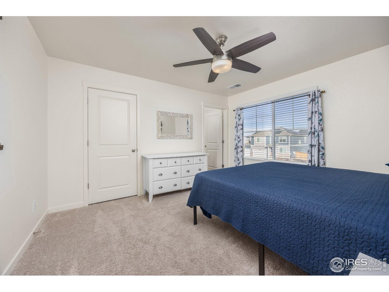 3725 Catmint Street Wellington, CO 80549 - Photo 26 of 44 2nd Primary Suite Bedroom, walk in closet behind the left closed door, full bathroom in the open right side door