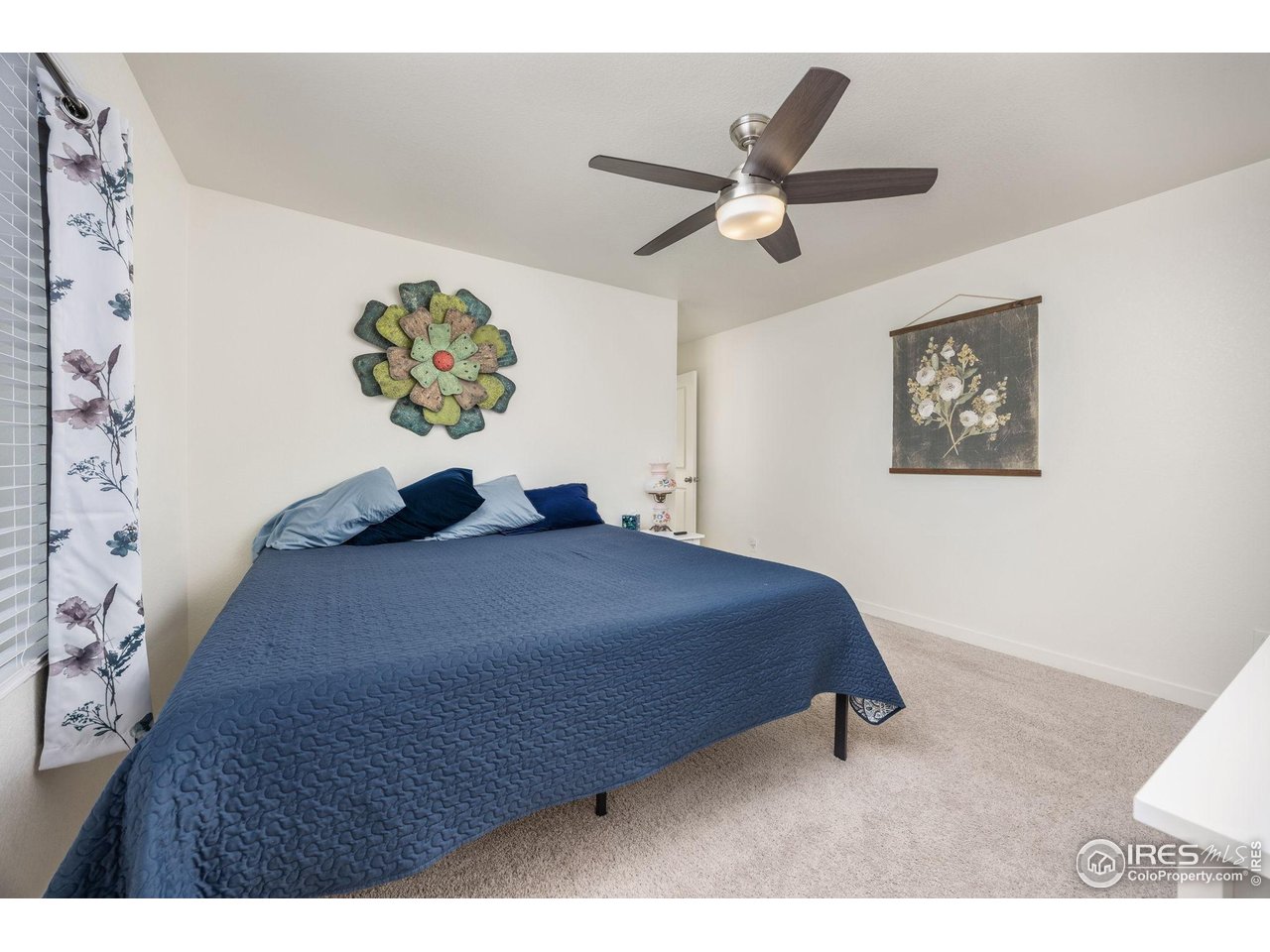 3725 Catmint Street Wellington, CO 80549 - Photo 27 of 44 This spacious second primary suite offers ample room and comfort, perfect for relaxation or hosting guests. It features a generous layout, ideal for creating a tranquil and inviting space.