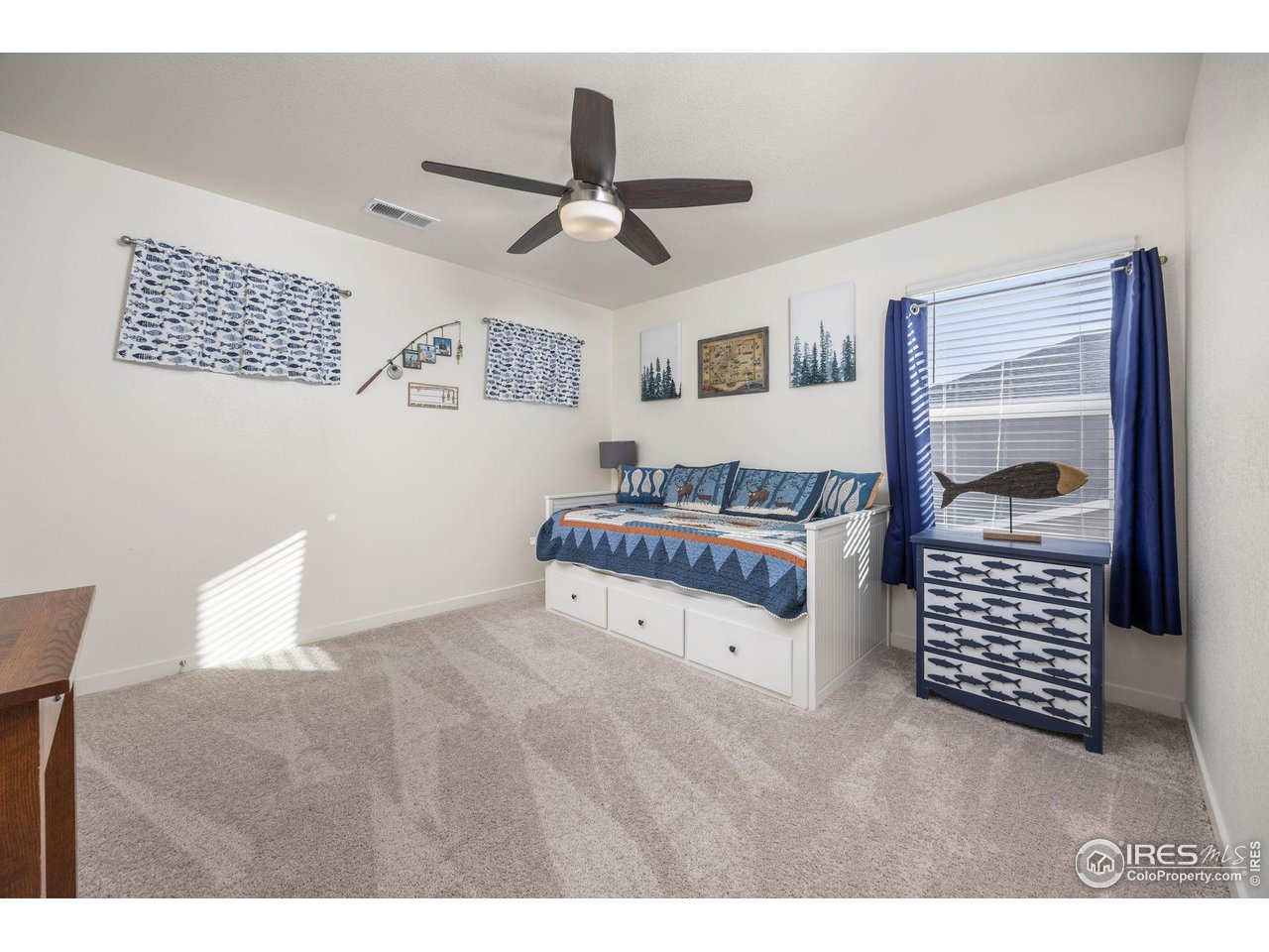 3725 Catmint Street Wellington, CO 80549 - Photo 29 of 44 Another spacious upstairs bedroom with ample natural light, perfect for relaxation or as a comfortable guest suite.