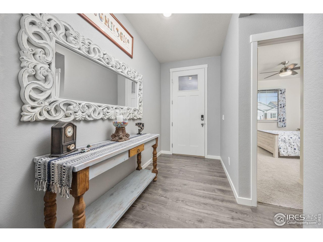 3725 Catmint Street Wellington, CO 80549 - Photo 6 of 44 Welcoming foyer for your family and friends to enter into. This space offers an inviting first impression, setting a warm and comfortable tone for the entire home.