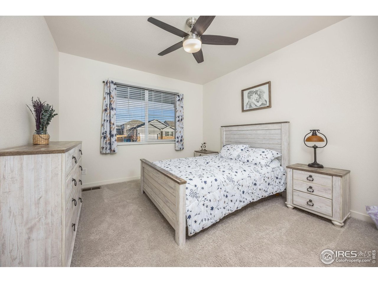 3725 Catmint Street Wellington, CO 80549 - Photo 7 of 44 Private guest bedroom located on the main floor, offering comfort and convenience for visitors.