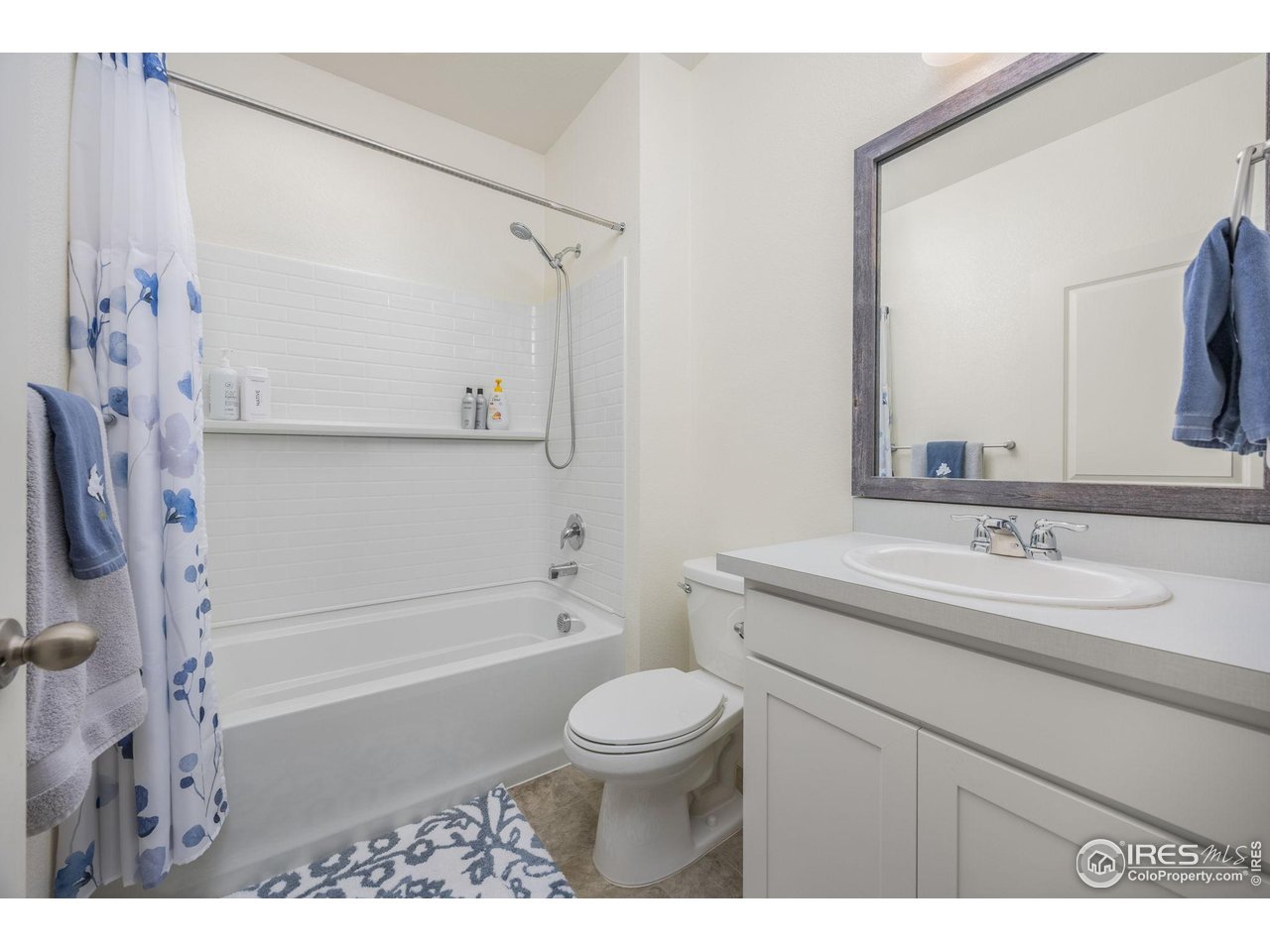 3725 Catmint Street Wellington, CO 80549 - Photo 9 of 44 Main floor full bath conveniently located just off the bedroom, offering comfort and ease of access.