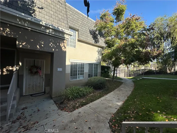 a front view of a house having yard