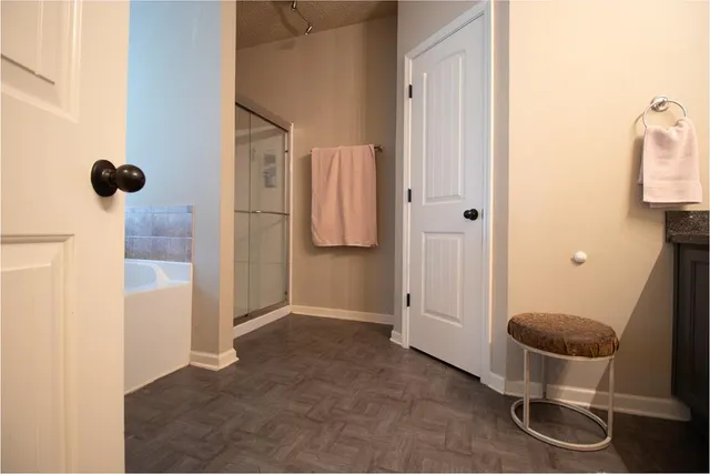 a bathroom with a toilet and a shower