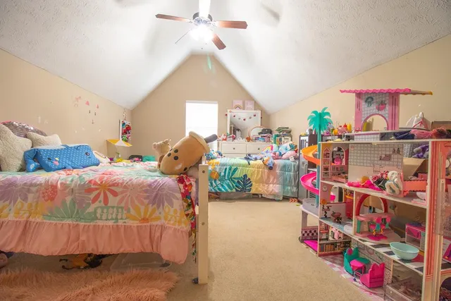 a bed room with a bed and a couch