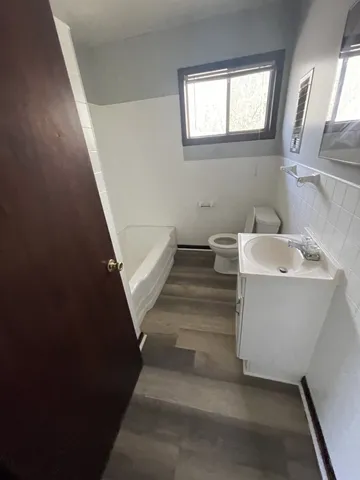 a view of entryway and kitchen