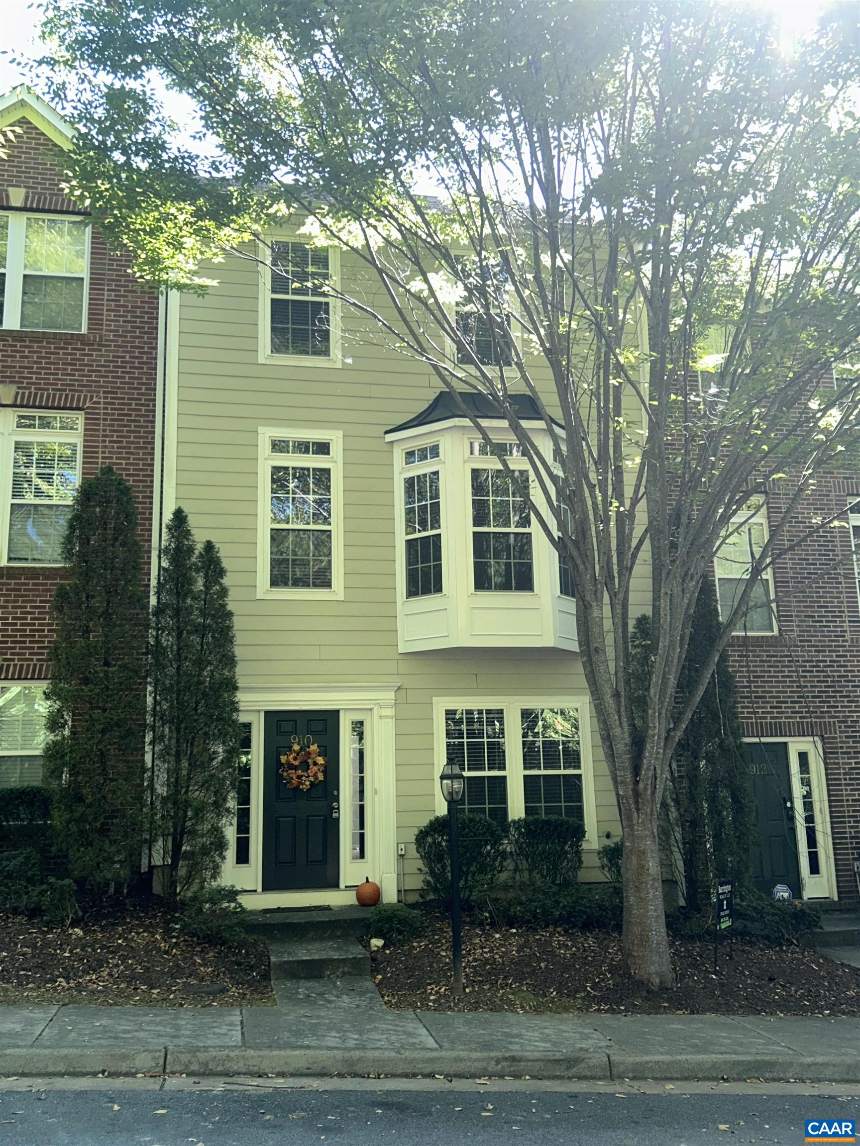 a front view of a house with yard