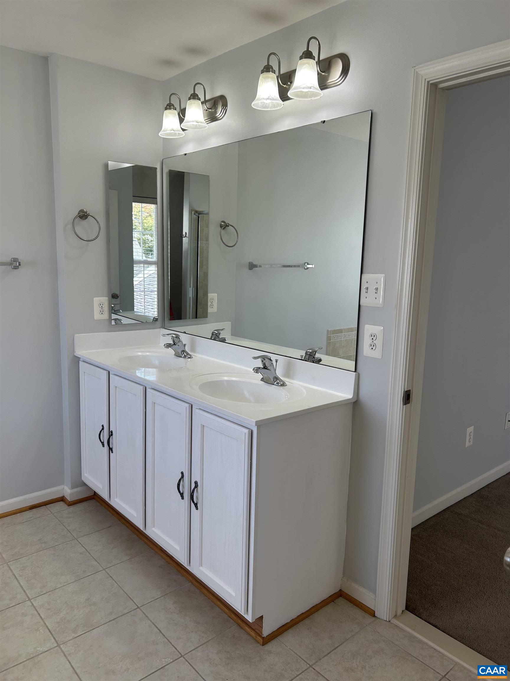 910 Rainier Road Charlottesville, VA 22903 - Photo 22 of 43 a bathroom with a sink vanity and mirror