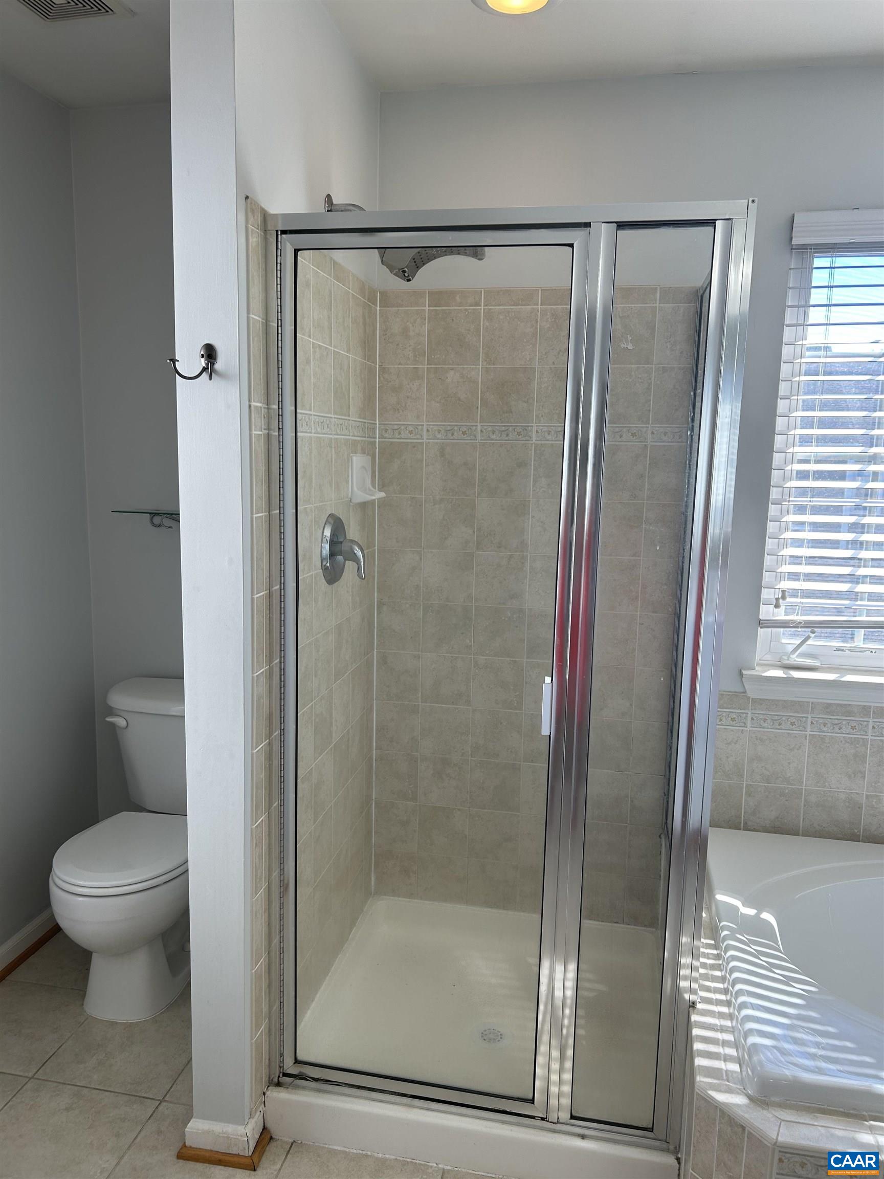 910 Rainier Road Charlottesville, VA 22903 - Photo 23 of 43 a bathroom with a glass shower door