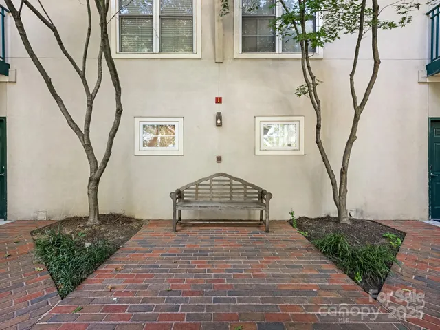 a view of a brick house with many windows