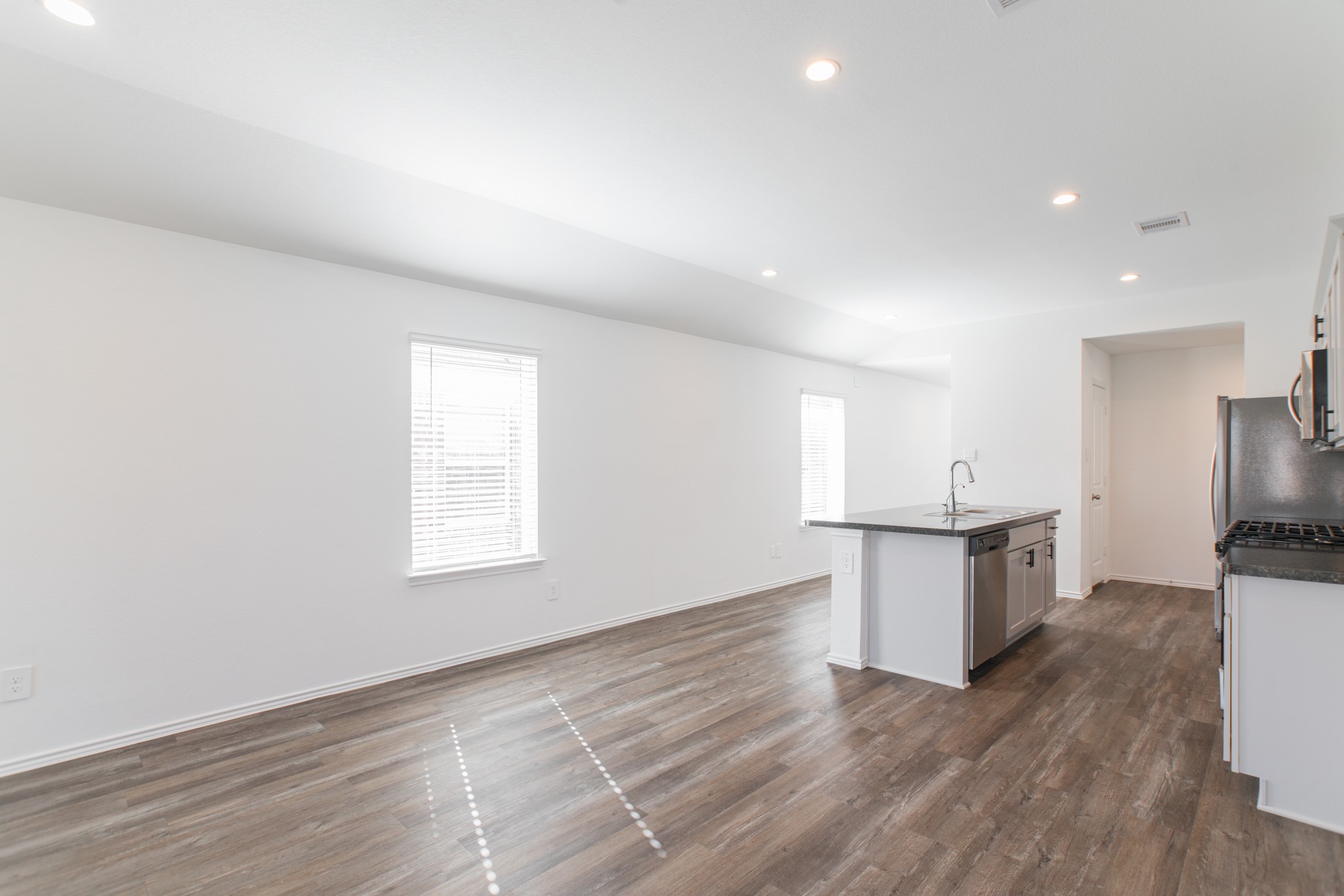 24314 Pebble Cres Lane Spring, TX 77373 - Photo 14 of 37 a view of kitchen with sink and wooden floor