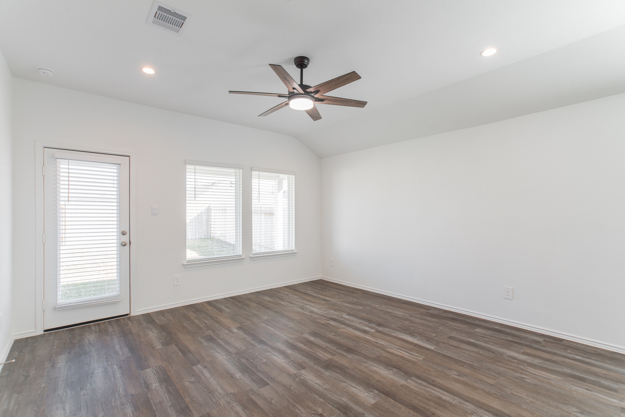 24314 Pebble Cres Lane Spring, TX 77373 - Photo 18 of 37 wooden floor in an empty room with a window