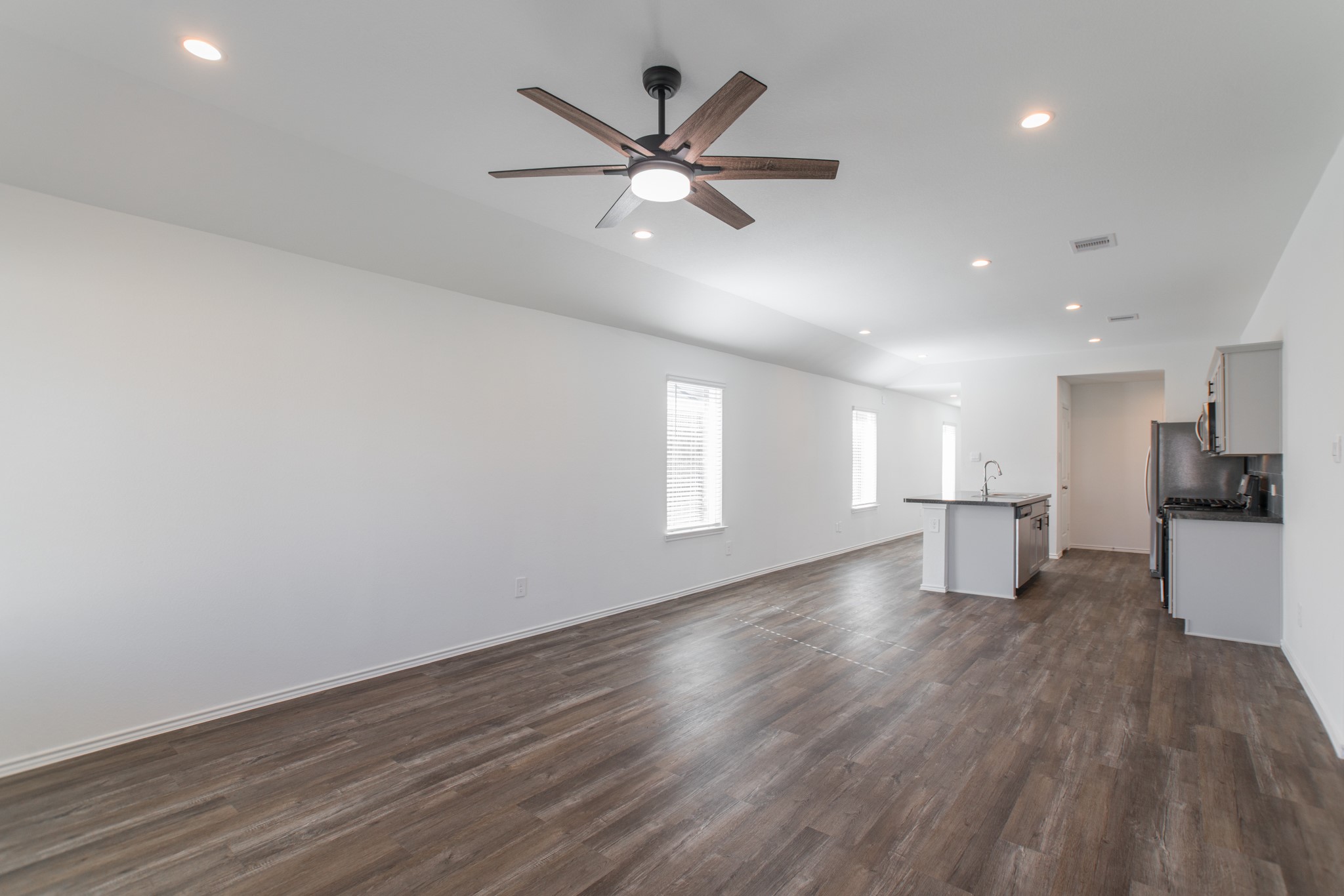 24314 Pebble Cres Lane Spring, TX 77373 - Photo 19 of 37 wooden floor in an empty room with a window