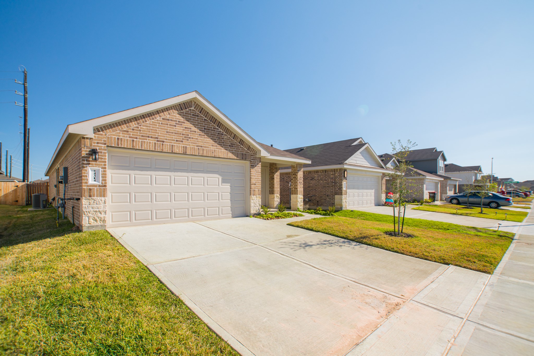 24314 Pebble Cres Lane Spring, TX 77373 - Photo 2 of 37 a front view of a house with a yard