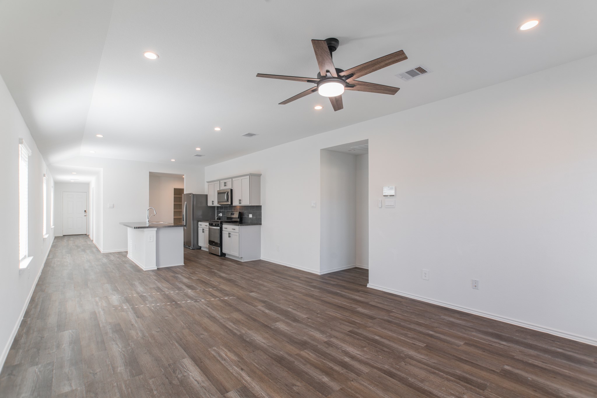 24314 Pebble Cres Lane Spring, TX 77373 - Photo 21 of 37 a view of a kitchen with wooden floor and a window