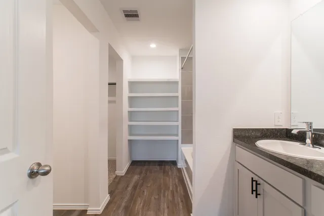 a bathroom with a sink and a mirror