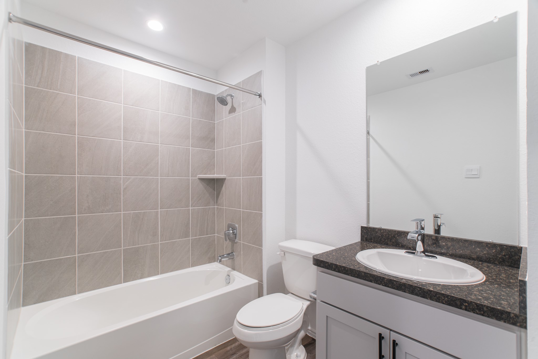 24314 Pebble Cres Lane Spring, TX 77373 - Photo 30 of 37 a bathroom with a sink a toilet and a mirror
