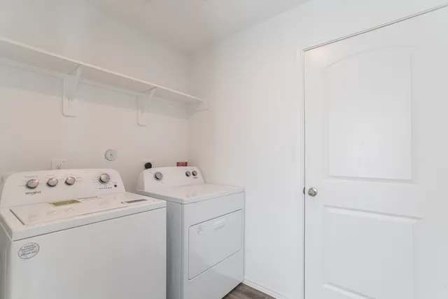 a view of storage and utility room with washer and dryer