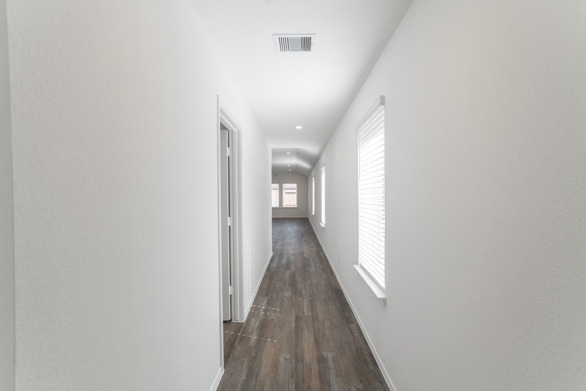 24314 Pebble Cres Lane Spring, TX 77373 - Photo 5 of 37 a view of a hallway with wooden floor