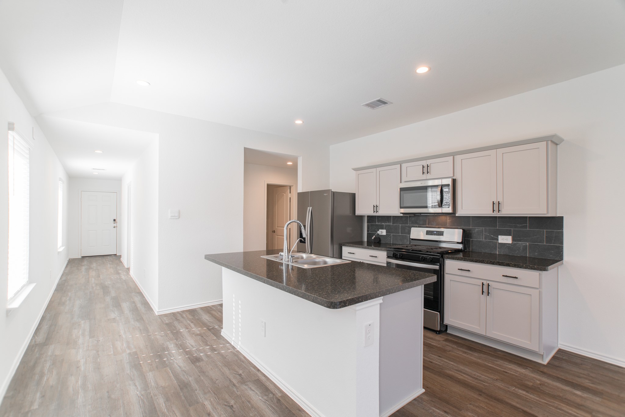 24314 Pebble Cres Lane Spring, TX 77373 - Photo 8 of 37 a kitchen with stainless steel appliances granite countertop a sink stove and refrigerator