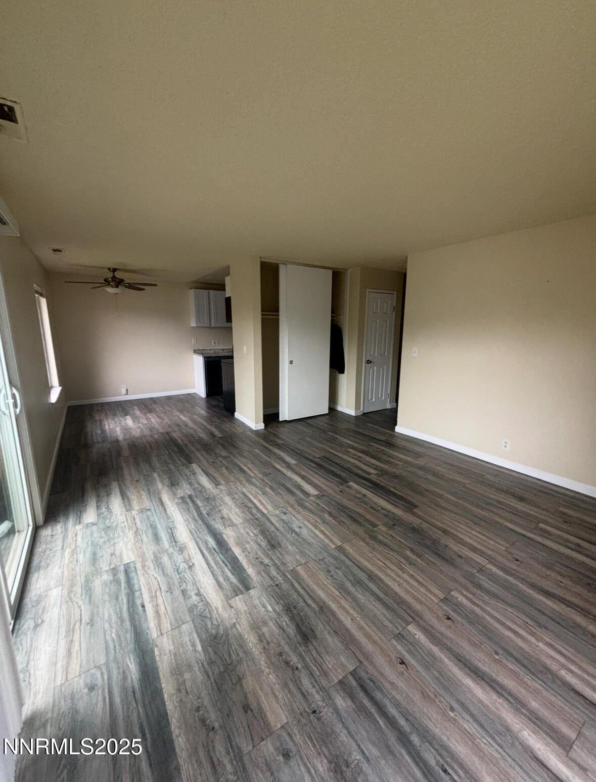 4604 Neil Road, Unit 114 Reno, NV 89502 - Photo 1 of 15 a view of wooden floor in an empty room
