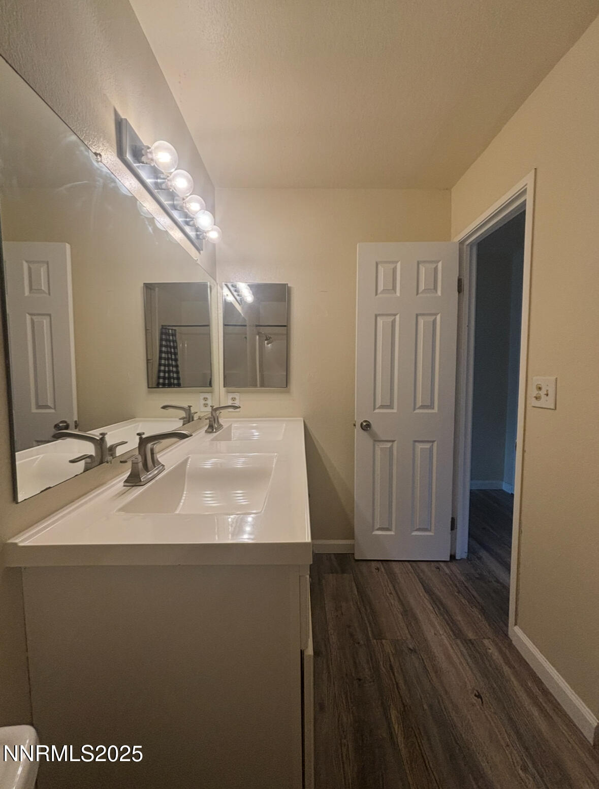 4604 Neil Road, Unit 114 Reno, NV 89502 - Photo 14 of 15 a bathroom with a sink and a mirror