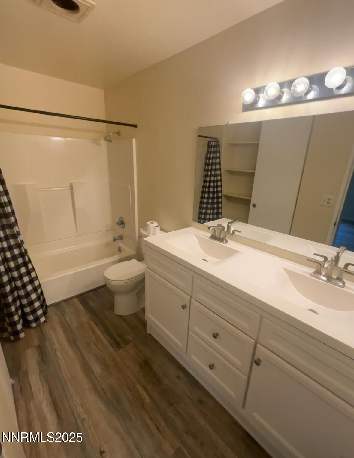 4604 Neil Road, Unit 114 Reno, NV 89502 - Photo 15 of 15 a bathroom with a double vanity sink mirror and toilet