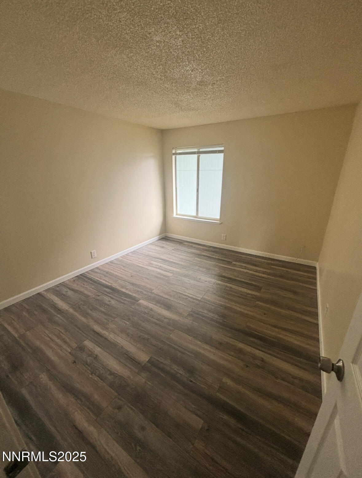 4604 Neil Road, Unit 114 Reno, NV 89502 - Photo 5 of 15 a view of an empty room with a window