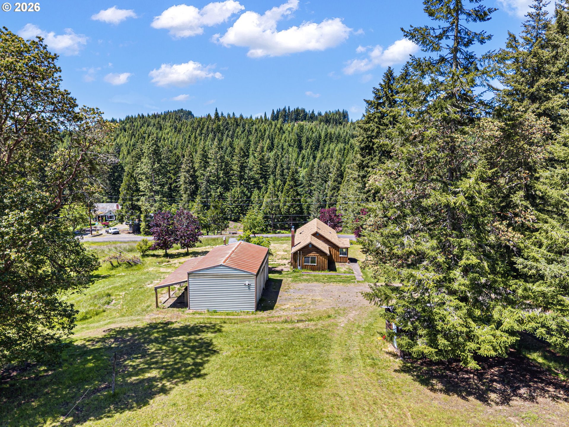 77521 Brock Road Oakridge, OR 97463 - Photo 25 of 48 a view of a house with a yard