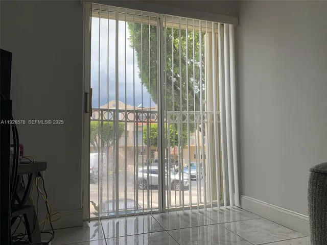 a view of a window and an empty room