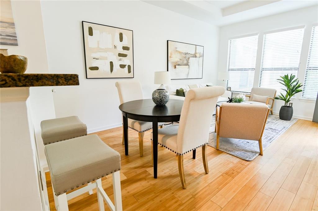 821 Ralph McGill Boulevard Northeast, Unit 2416 Atlanta, GA 30306 - Photo 17 of 44 a living room with furniture and wooden floor