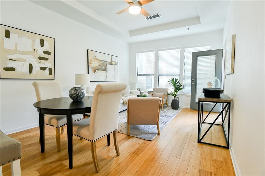 821 Ralph McGill Boulevard Northeast, Unit 2416 Atlanta, GA 30306 - Photo 18 of 44 a dining room with furniture and window