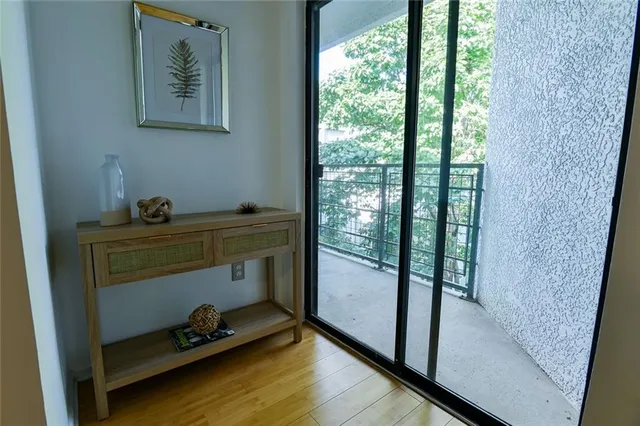 a spacious bedroom with a bed and painting on the wall