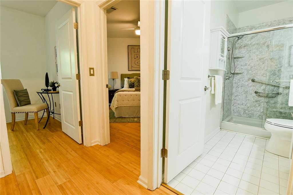 821 Ralph McGill Boulevard Northeast, Unit 2416 Atlanta, GA 30306 - Photo 25 of 44 a bathroom with a glass shower door