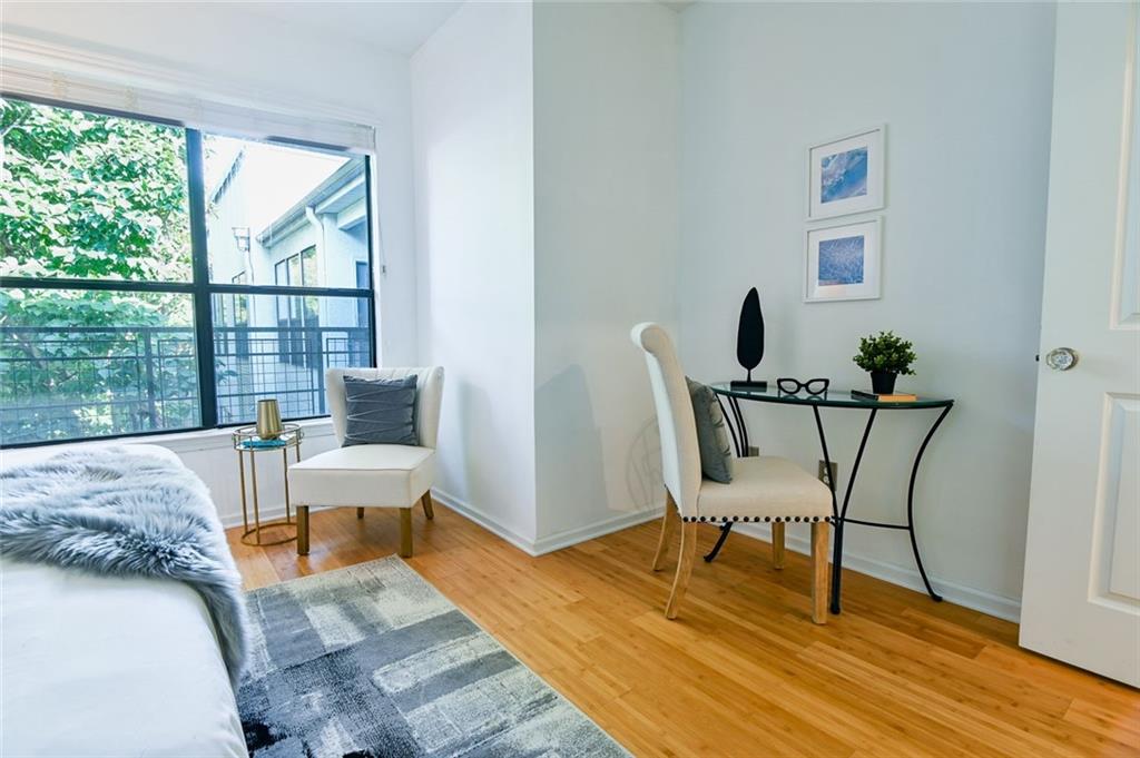 821 Ralph McGill Boulevard Northeast, Unit 2416 Atlanta, GA 30306 - Photo 30 of 44 a view of a livingroom with furniture and wooden floor