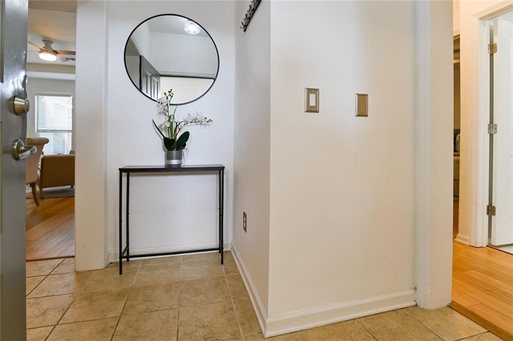 821 Ralph McGill Boulevard Northeast, Unit 2416 Atlanta, GA 30306 - Photo 3 of 44 a front view of a house with wooden floor and a potted plant