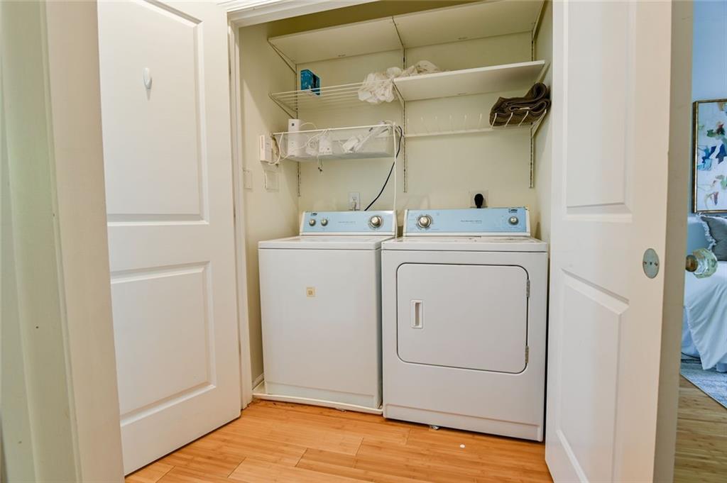821 Ralph McGill Boulevard Northeast, Unit 2416 Atlanta, GA 30306 - Photo 32 of 44 a view of a storage & utility room with dryer and washer