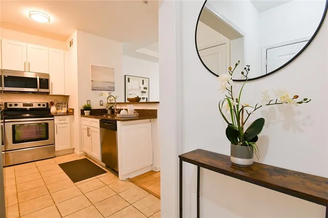 a kitchen with a stove sink and a microwave