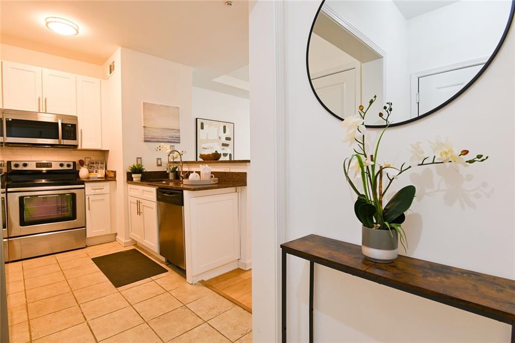 821 Ralph McGill Boulevard Northeast, Unit 2416 Atlanta, GA 30306 - Photo 4 of 44 a view of a kitchen area with furniture
