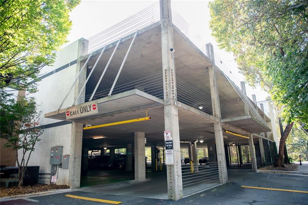 821 Ralph McGill Boulevard Northeast, Unit 2416 Atlanta, GA 30306 - Photo 42 of 44 a view of a tall building with a tree