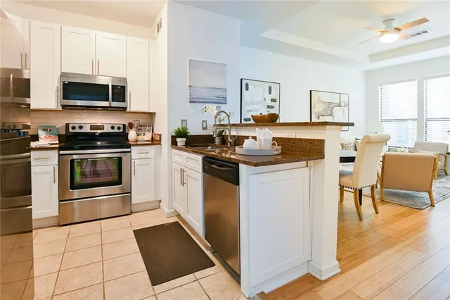 a kitchen with a stove and a cabinets